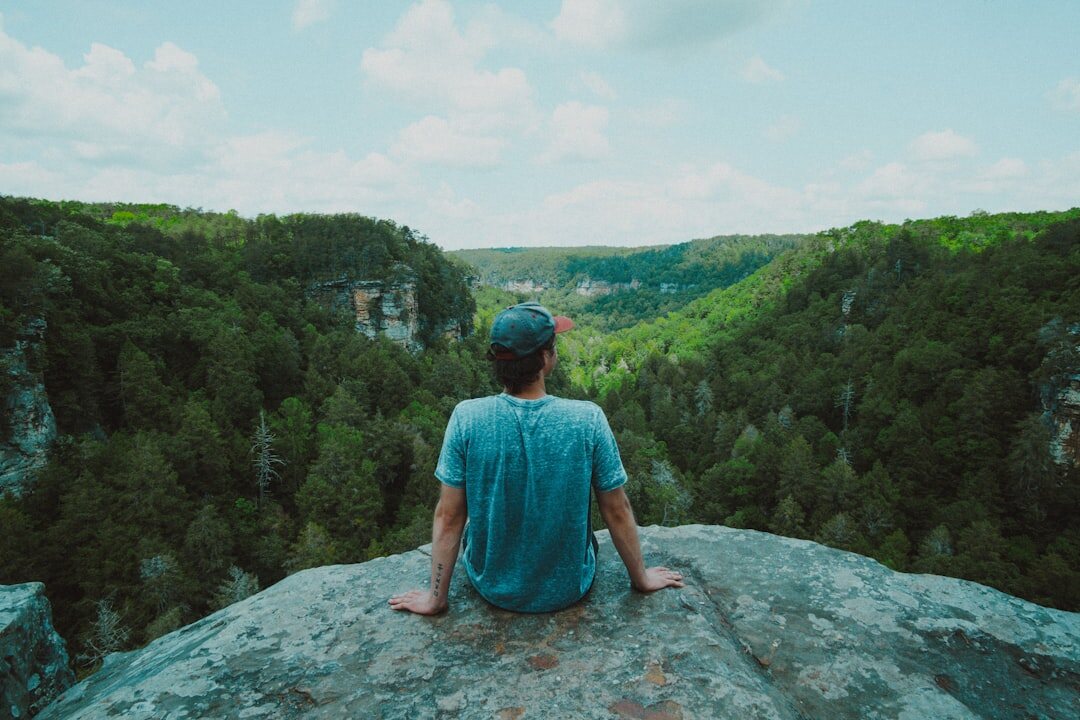 person meditating in nature