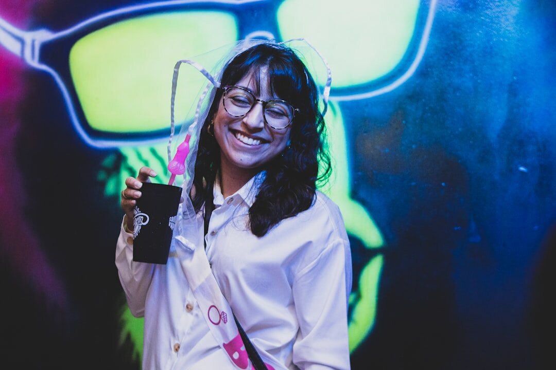 Friendly Brazilian woman wearing a headset smiling during a video conversation
