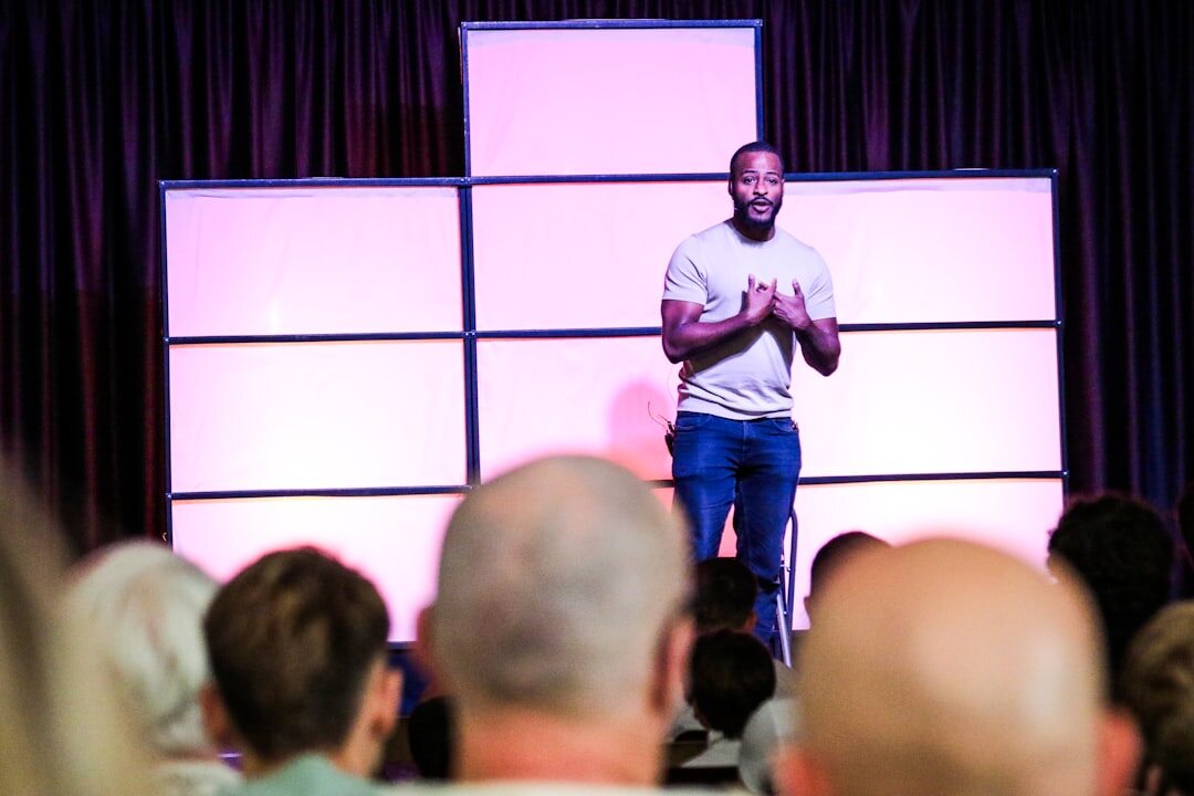 confident speaker on stage