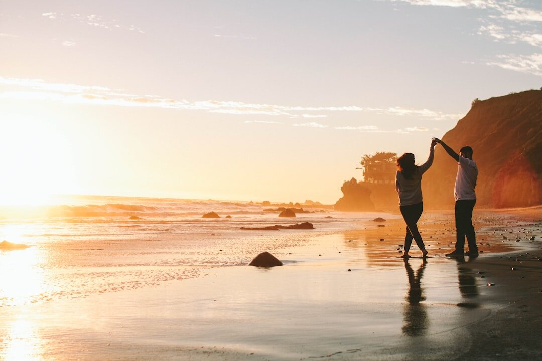 sunset couple holding hands